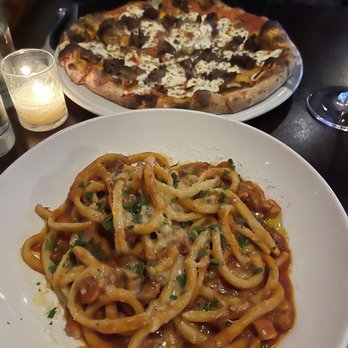 Rinata - Bucatini with sausage pasta in background - Italian Near Me - Minneapolis, Minnesota Rinata - Bucatini with sausage pasta in background - Italian Near Me - Minneapolis, Minnesota
