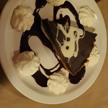 Dick & Jenny's - Double dark chocolate tart with an almond crust - Cajun/Creole Near Me - Grand Island, New York Dick & Jenny's - Double dark chocolate tart with an almond crust - Cajun/Creole Near Me - Grand Island, New York