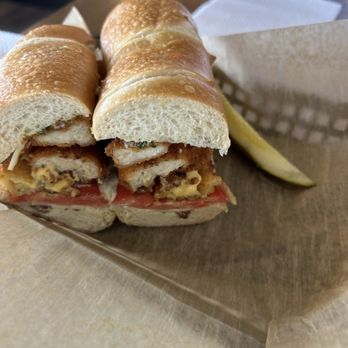 Brown Bag Deli - Sandwich with chicken nuggets and a pickle - Delis Near Me - Elgin, South Carolina