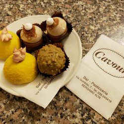 Pasticceria Cavour - Rocher pistacchio, Italian beignet filled with pistachiocream and covered in pistachio icing, Polentine e Osei