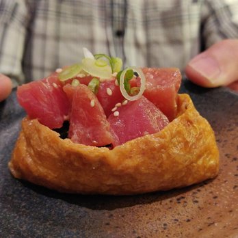 Tora Sushi - a person holding a plate of food - Japanese Near Me - Markham, Ontario