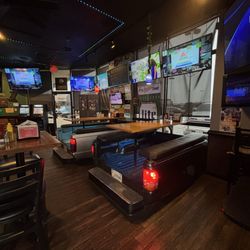 The Tailgate Sports Pub - Truck bed table seating!