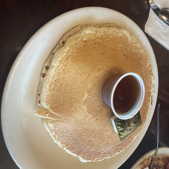 Landmark Grill - Giant Spongy pancake with butter and maple syrup - Breakfast & Brunch Near Me - Midvale, Utah Landmark Grill - Giant Spongy pancake with butter and maple syrup - Breakfast & Brunch Near Me - Midvale, Utah