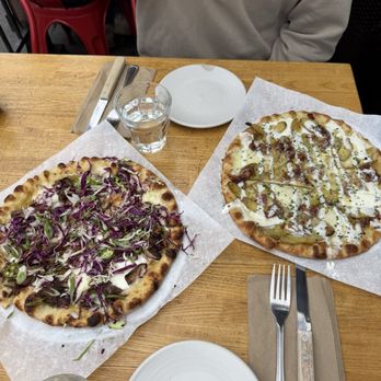 Pizzetta 211 - Short rib pizza (left) and bacon potato pizza (right) - Pizza Near Me - San Francisco, California Pizzetta 211 - Short rib pizza (left) and bacon potato pizza (right) - Pizza Near Me - San Francisco, California