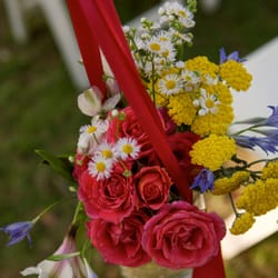 Growing Wild Floral - These posies hung from the chairs that lined the aisle to the altar.