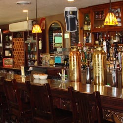 Queens Bush Pub - The bar at the Queens Bush Pub. Check out the old fire extinguishers that the beer taps are mounted on