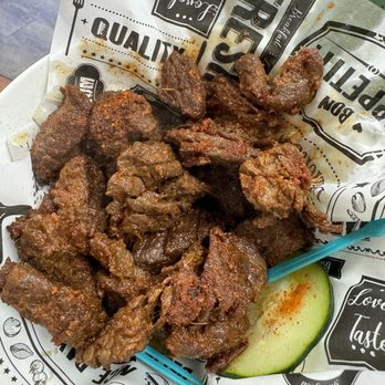 Agege Bites - Wet suya. No onions but you get sliced cucumber. Goodness gracious - African Near Me - Chandler, Arizona