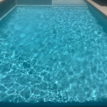 Neighborhood Pool Service - Freshly cleaned chlorine pool - Pool Cleaners Near Me