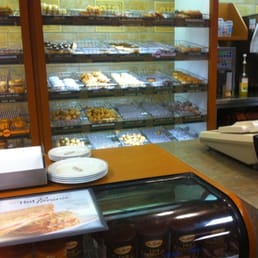 a display of pastries in a bakery a display of pastries in a bakery
