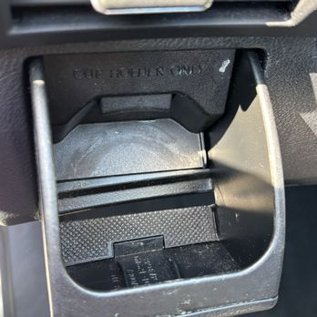 Shine & Dash Detaliing - Cup holder that held hand sanitizer bottle that was not lifted or cleaned. - Auto Detailing Near Me