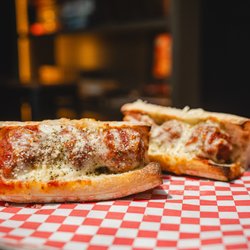 Goodfellas Pizzeria - Mainstrasse - Our famous meatball sub, baked, cheesy, and unforgettable.