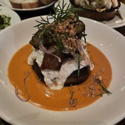 Stuffed Lamb Belly with Mojo Rojo, Burnt Onion Yogurt & Pumpkin Seeds
