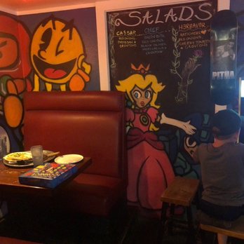 Antics Pizza - Seats and games - Pizza Near Me - Hilo, Hawaii