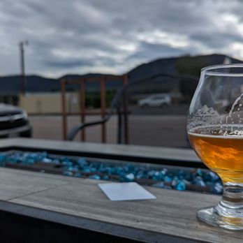 Trails End Taproom - a glass of beer on a table - Beer Bar Near Me - Monument, Colorado