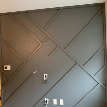 Calianese Painting - Wood paneling accent wall with fresh paint - Painters Near Me