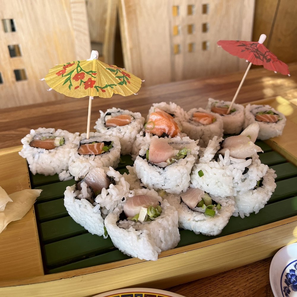 Sakura Japanese Restaurant - a plate of sushi with a parasol - Sushi Bars Near Me - Monterey, California Sakura Japanese Restaurant - a plate of sushi with a parasol - Sushi Bars Near Me - Monterey, California