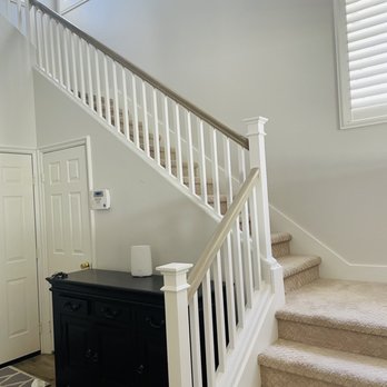 IPL Painting - The updates newel posts and caps, fresh paint on walls and woodwork and the faux painted hand rails. - Painters Near Me