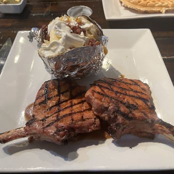 Burton's Farmhouse - Double bone-in pork chops with a brown sugar marinade and a loaded baked potato. - Breakfast & Brunch Near Me - Paoli, Indiana Burton's Farmhouse - Double bone-in pork chops with a brown sugar marinade and a loaded baked potato. - Breakfast & Brunch Near Me - Paoli, Indiana
