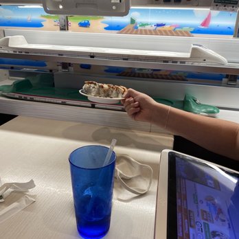 Genki Sushi - Both trains delivering food, then press flashing button to send back train - Sushi Bars Near Me - Honolulu, Hawaii Genki Sushi - Both trains delivering food, then press flashing button to send back train - Sushi Bars Near Me - Honolulu, Hawaii