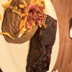 Low Tide Steak House - 16oz New York Strip with loaded baked potato.