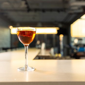 Sky Blu Rooftop - a glass of wine on a counter - Venues & Event Spaces Near Me - Dallas, Texas Sky Blu Rooftop - a glass of wine on a counter - Venues & Event Spaces Near Me - Dallas, Texas