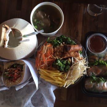 Roll Play - Coconut juice, side of beef pho, pork belly noodle bowl, shrimp spring rolls, banh mi - Vietnamese Near Me - Vienna, Virginia Roll Play - Coconut juice, side of beef pho, pork belly noodle bowl, shrimp spring rolls, banh mi - Vietnamese Near Me - Vienna, Virginia