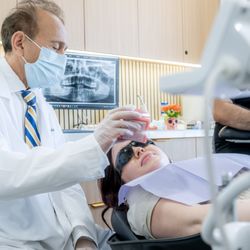Orthodontics In Woodland Hills - Dr. Z providing personalized orthodontic care during a patient appointment.