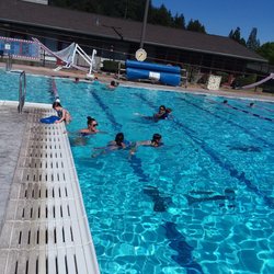 Cougar Swim School - Cougar Swim School guards teaching kids in the crystal clear pool at SLV high school