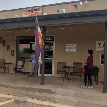 Ragin' Hog BBQ - wo people standing outside of a restaurant - Barbeque Near Me - Denver, Colorado Ragin' Hog BBQ - wo people standing outside of a restaurant - Barbeque Near Me - Denver, Colorado