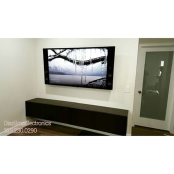 Diaz Bros Electronics - In wall install on a tilting wallmount. Floating media cabinet. - Home Theatre Installation Near Me