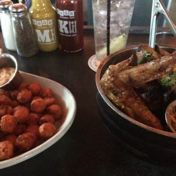 Brgr Kitchen Plus Bar - Dry rub wings and sweet potato tots. Topped off with a shot of some local iron horse bourbon. - Burgers Near Me - Kansas City, Missouri