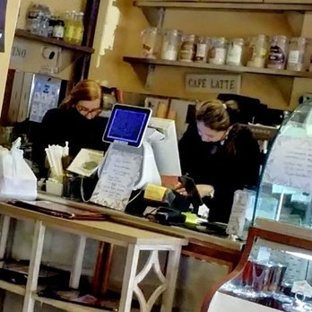 Bakery Bread & Grill - Women counting out their tips before paying attention to customers who have been waiting for quite some time. - Latin American Near Me - Fairfax, Virginia