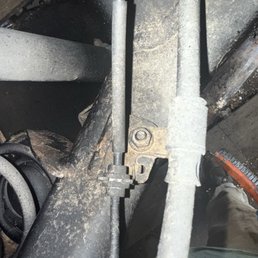 Park brake cable left untouched as well as visible debris even after the second application.