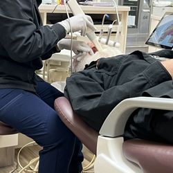 Pro Dental - Taking pictures of his teeth