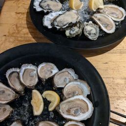 Oysters! Can't remember which ones but they were all good! The ones on the bottom are the dollar per shuck Oysters! Can't remember which ones but they were all good! The ones on the bottom are the dollar per shuck
