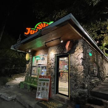 JuiceLand - the entrance to a juice shop at night - Juice Bars & Smoothies Near Me - Austin, Texas