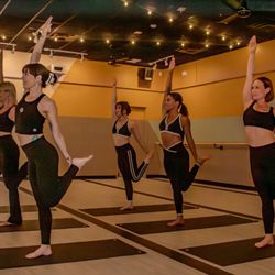 The Foundry - Standing bow pulling pose - try our 90 minute 26&2 class!