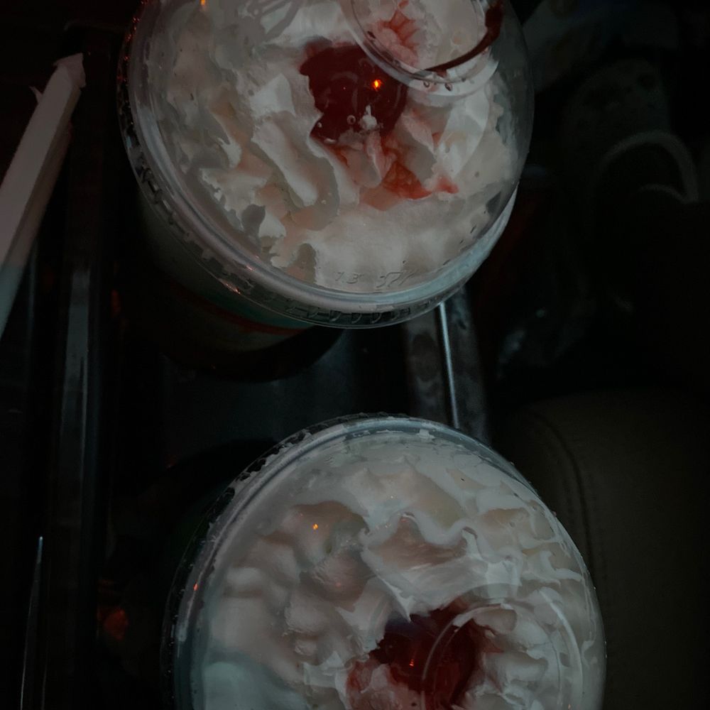 two desserts with whipped cream and cherries two desserts with whipped cream and cherries
