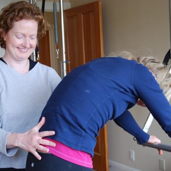 Simply Balanced - Susan teaching Cat on the trapeze table - Pilates Near Me - San Francisco, California Simply Balanced - Susan teaching Cat on the trapeze table - Pilates Near Me - San Francisco, California
