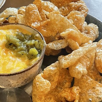 Posada Alta Cocina - Crispy Cracklin Chicharrones with queso Mexicano sauce, corn and hatch green chiles. - Desserts Near Me - Livermore, California Posada Alta Cocina - Crispy Cracklin Chicharrones with queso Mexicano sauce, corn and hatch green chiles. - Desserts Near Me - Livermore, California