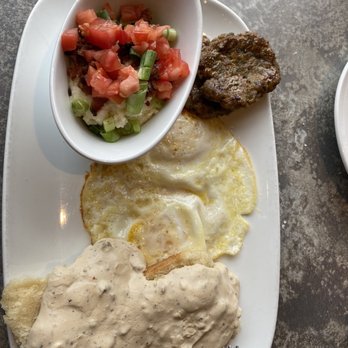Another Broken Egg Cafe - Biscuits and gravy with city grits - Breakfast & Brunch Near Me - Nashville, Tennessee Another Broken Egg Cafe - Biscuits and gravy with city grits - Breakfast & Brunch Near Me - Nashville, Tennessee
