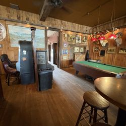 Stacey's Old Faithful Bar & Steakhouse - Gaming and pool table areas.
