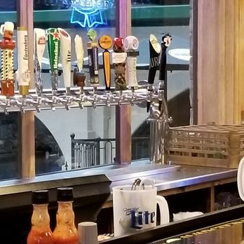 The Troll Tavern - The taps and glass wall behind it. - American Near Me - Helen, Georgia
