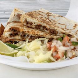 Kikos Tacos - 12 inch Quesadilla with any choice of meat and on the side a lettuce ,pico de gallo, avocado,sourcream and limes