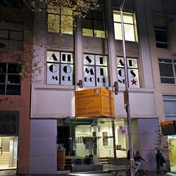 All Star Comics - The front facade at night.