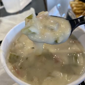 Wooly's - Very thick clam chowder (note how it drops off the spoon), lots of chunks, but bland for me - Seafood Near Me - Pismo Beach, California Wooly's - Very thick clam chowder (note how it drops off the spoon), lots of chunks, but bland for me - Seafood Near Me - Pismo Beach, California