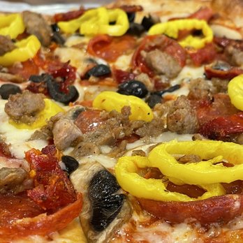 Ripfire Pizza & Bbq - Pepperoni, mushrooms, black olives, sundries tomatoes, banana peppers, and Italian sausage.....and flavor for miles. AKA "The Gabe" - Pizza Near Me - Sarasota, Florida