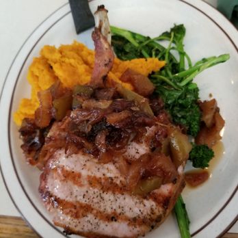 The Place - Center-cut pork chop with mashed sweet potato and vegetables - American Near Me - Buffalo, New York