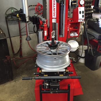 Precision Imports - This is a Hunter Auto34s tire changer. It allows us to change tires without touching the rim. - Auto Repair Near Me - Manchester, New Hampshire Precision Imports - This is a Hunter Auto34s tire changer. It allows us to change tires without touching the rim. - Auto Repair Near Me - Manchester, New Hampshire