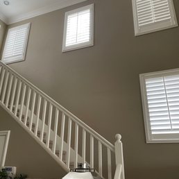 A before shot of my old white banister and Newell posts and caps and the old paint on the walls.